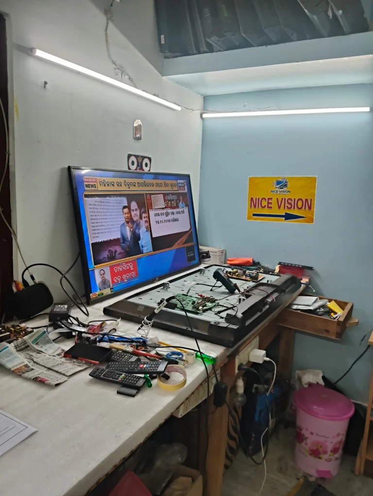 Expert Nice Vision technician repairing a TV motherboard at customer home